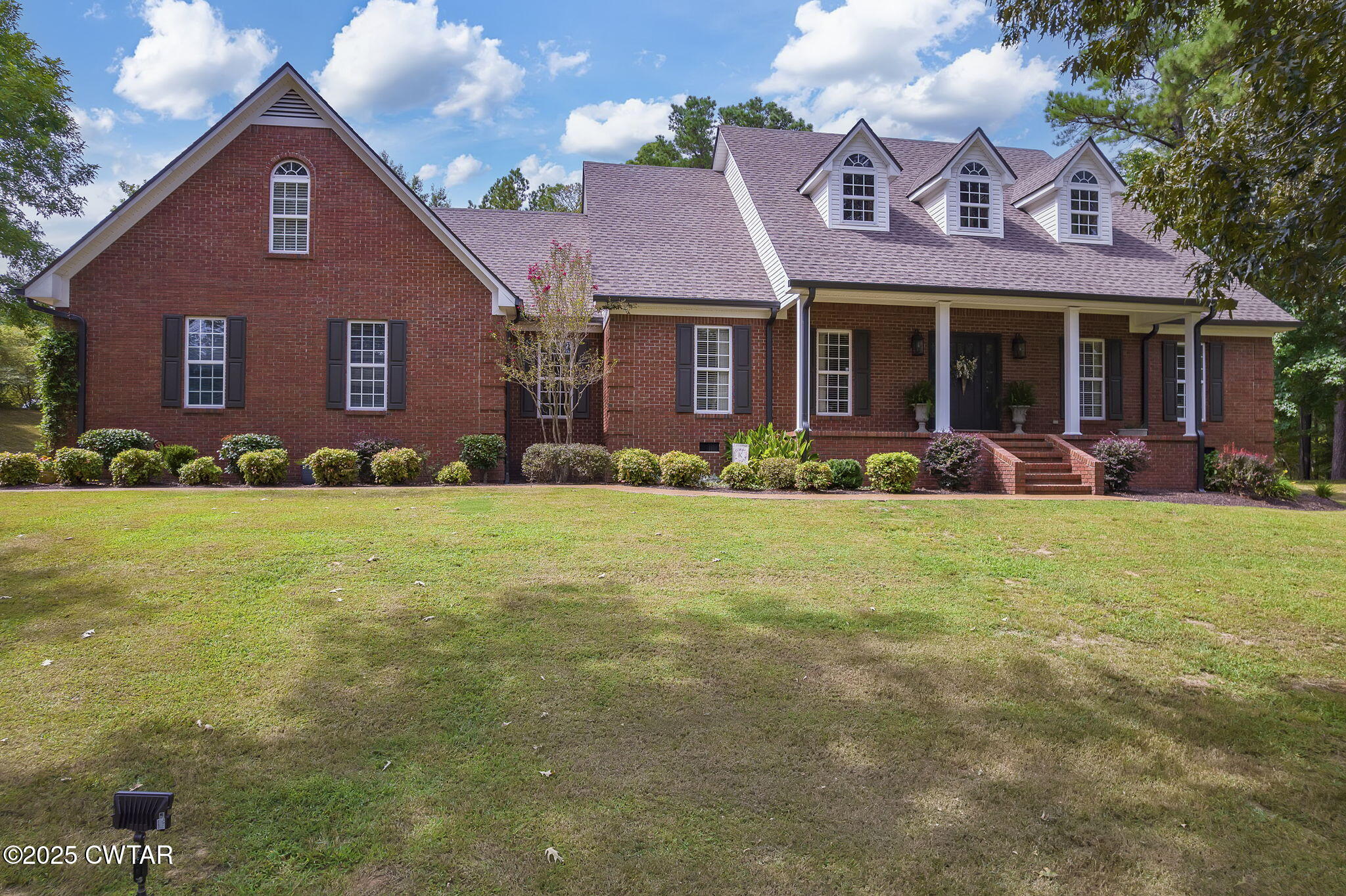 180 Medon Malesus Road Medon, TN 38356 - Photo 63 of 73 a front view of a house with a yard and garage