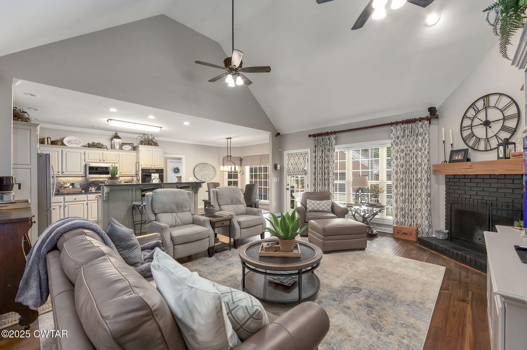 180 Medon Malesus Road Medon, TN 38356 - Photo 8 of 73 a living room with furniture a fireplace and a chandelier