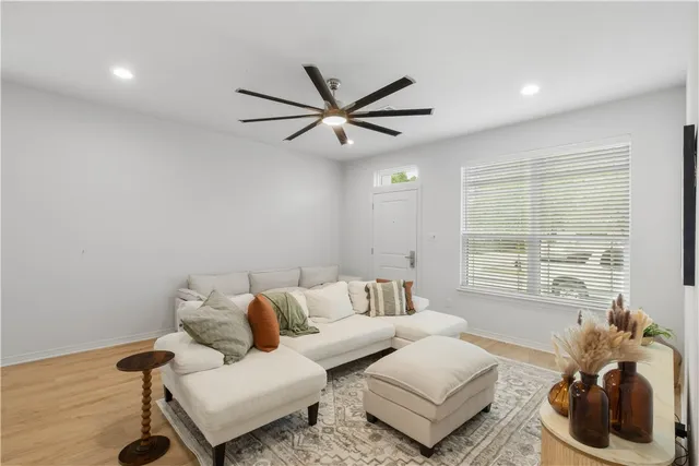 a living room with furniture and a large window