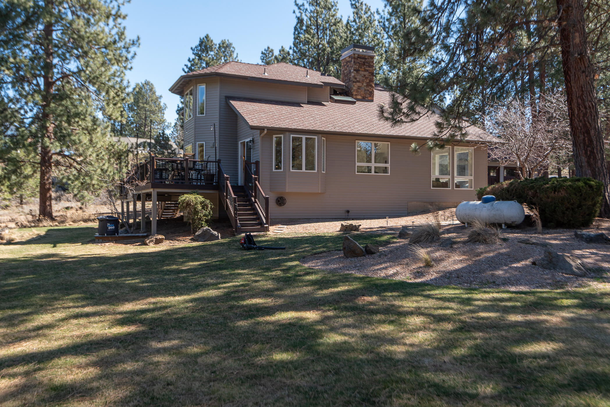 60012 West Ridgeview Drive Bend, OR 97702 - Photo 37 of 55 a front view of a house with a garden