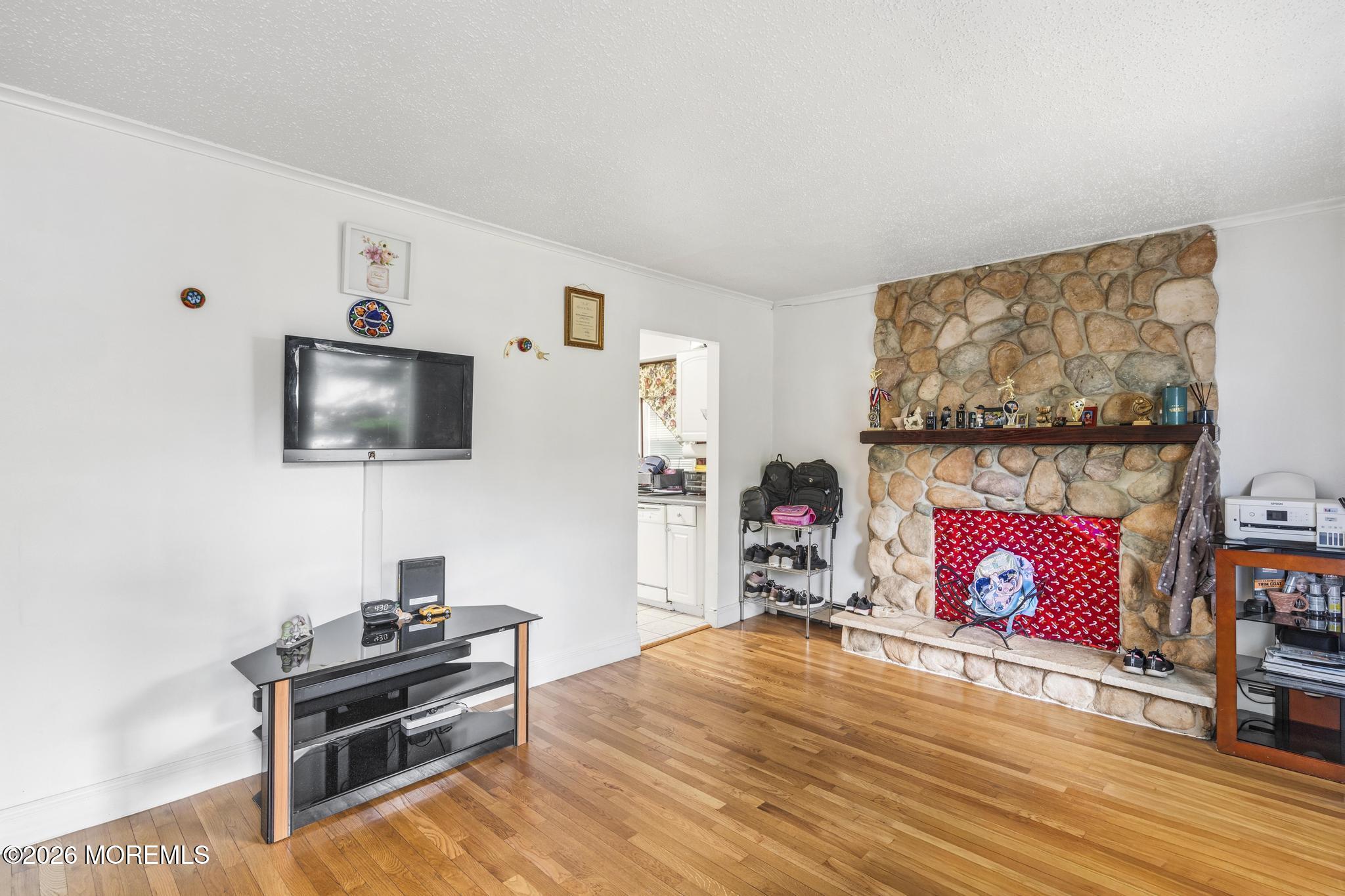 1914 Rutherford Avenue Neptune Township, NJ 07753 - Photo 7 of 25 a living room with furniture and a flat screen tv