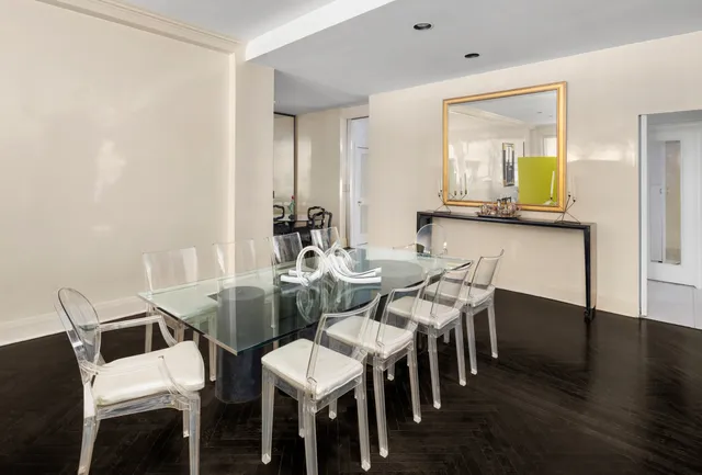 a dining room with furniture and wooden floor