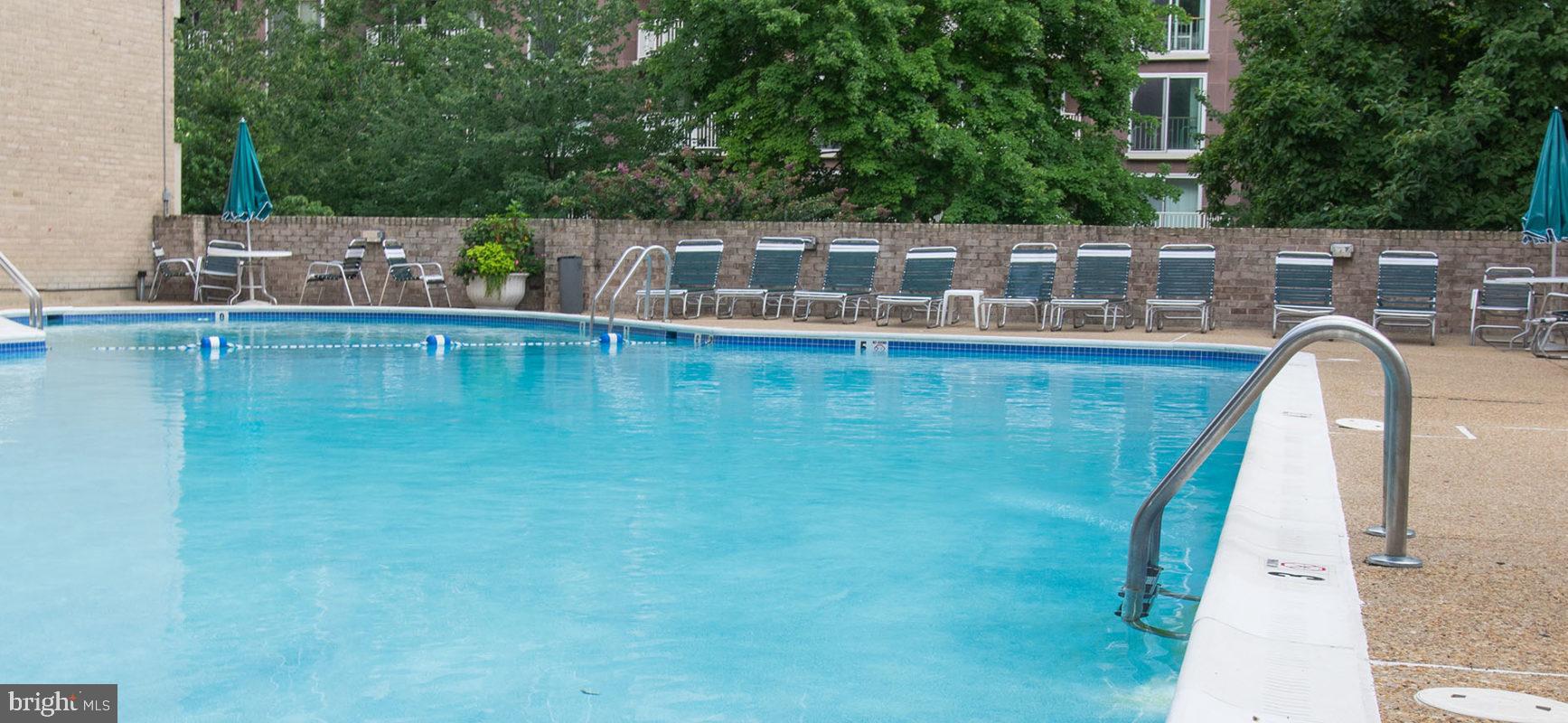 1245 4th Street Southwest, Unit E110 Washington, DC 20024 - Photo 11 of 14 a view of a swimming pool with a lake view