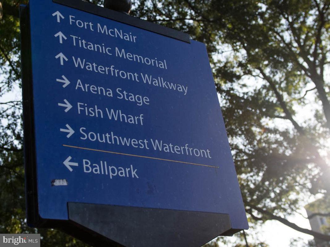 1245 4th Street Southwest, Unit E110 Washington, DC 20024 - Photo 14 of 14 a sign that is sitting on a brick wall