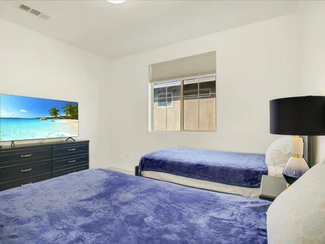 a bathroom with a double vanity sink toilet and shower