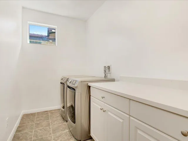 a spacious bathroom with a double vanity sink mirror and double