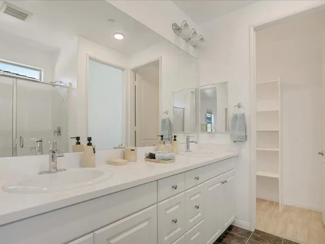 a view of a house with backyard porch and sitting area