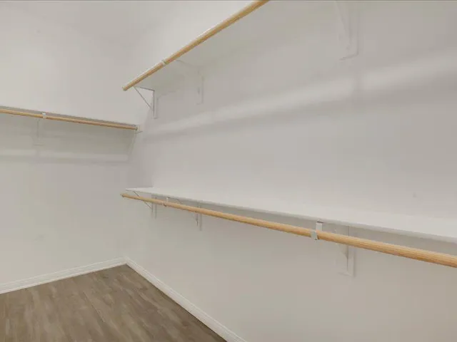 a view of swimming pool with lounge chairs