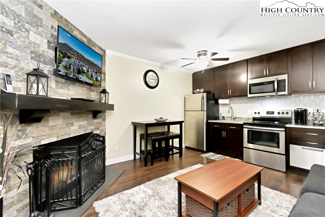 301 Pinnacle Inn Road, Unit 3230 Banner Elk, NC 28604 - Photo 1 of 40 a kitchen with kitchen island a stove and a refrigerator