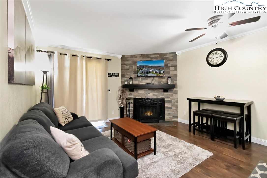 a living room with furniture and a fireplace