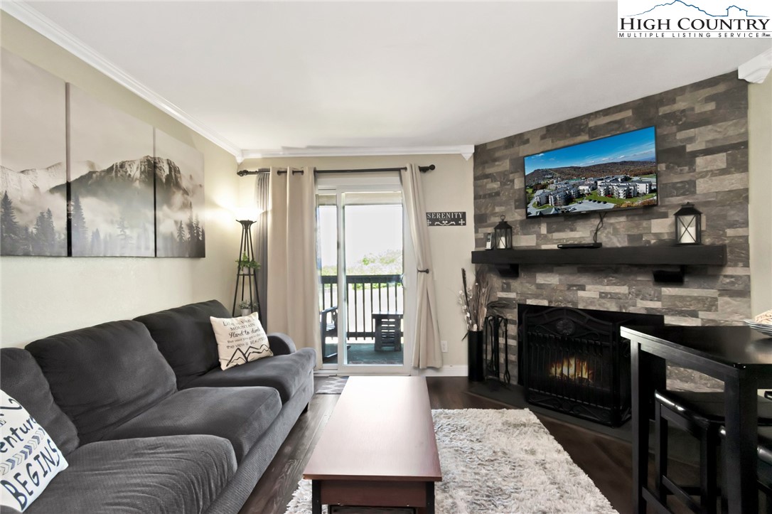 301 Pinnacle Inn Road, Unit 3230 Beech Mountain, NC 28604 - Photo 15 of 40 a living room with furniture and a fireplace