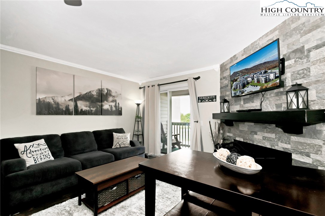 301 Pinnacle Inn Road, Unit 3230 Beech Mountain, NC 28604 - Photo 17 of 40 a living room with furniture and a window