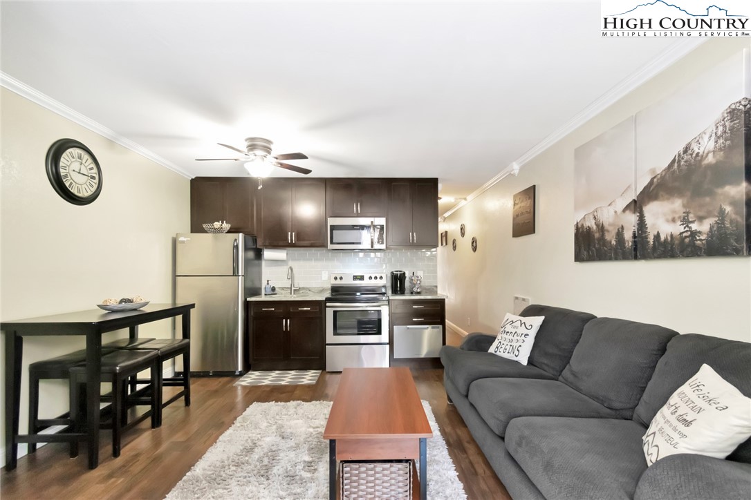 301 Pinnacle Inn Road, Unit 3230 Beech Mountain, NC 28604 - Photo 18 of 40 a kitchen with stainless steel appliances granite countertop a refrigerator and stove