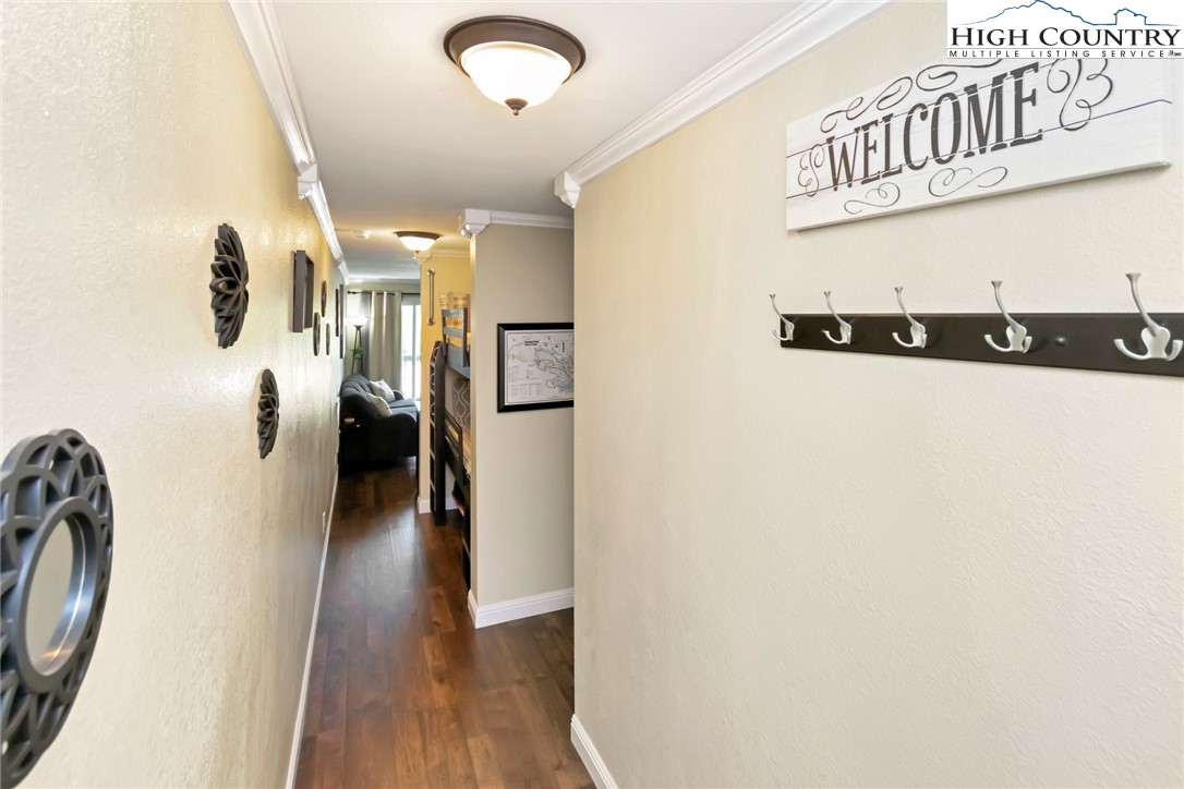 301 Pinnacle Inn Road, Unit 3230 Beech Mountain, NC 28604 - Photo 10 of 40 a view of a hallway with wooden floor