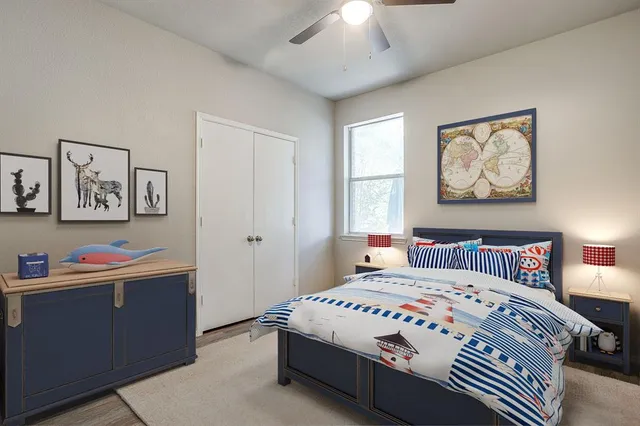 a bedroom with a bed and a chandelier