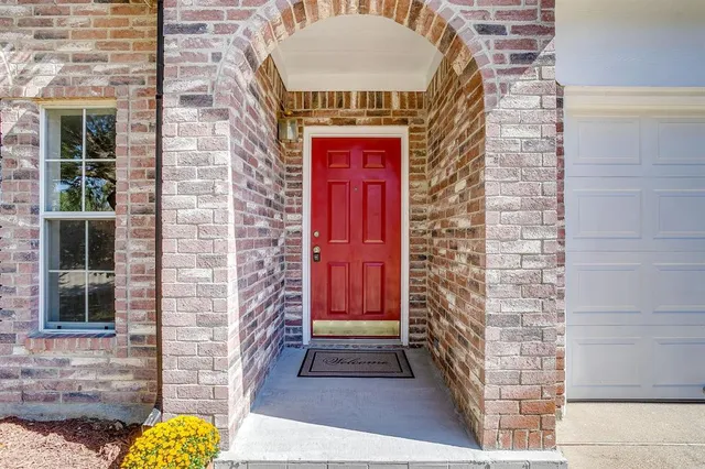 a front view of a house with glass windows