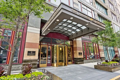 a front view of a building with sitting area