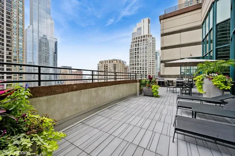 a view of a balcony with sitting area