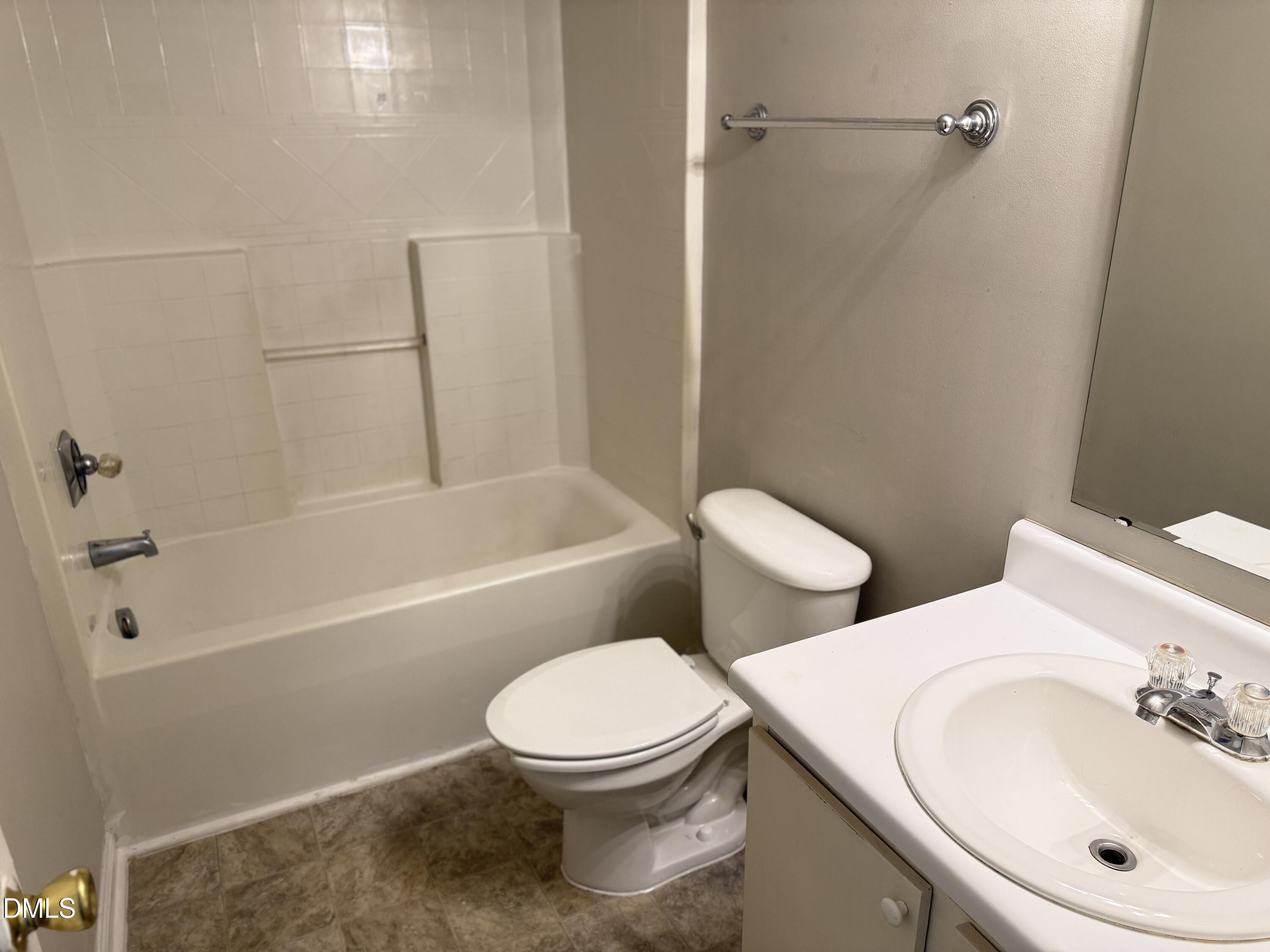 4832 Silverdene Street Raleigh, NC 27616 - Photo 12 of 15 a bathroom with a toilet sink and shower