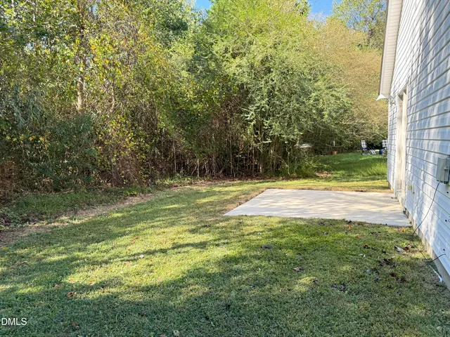 a view of outdoor space with deck and yard