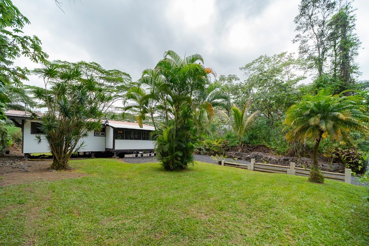 14-3508 Waimea Road Pahoa, HI 96778 - Photo 12 of 21 a swimming pool with outdoor seating and yard