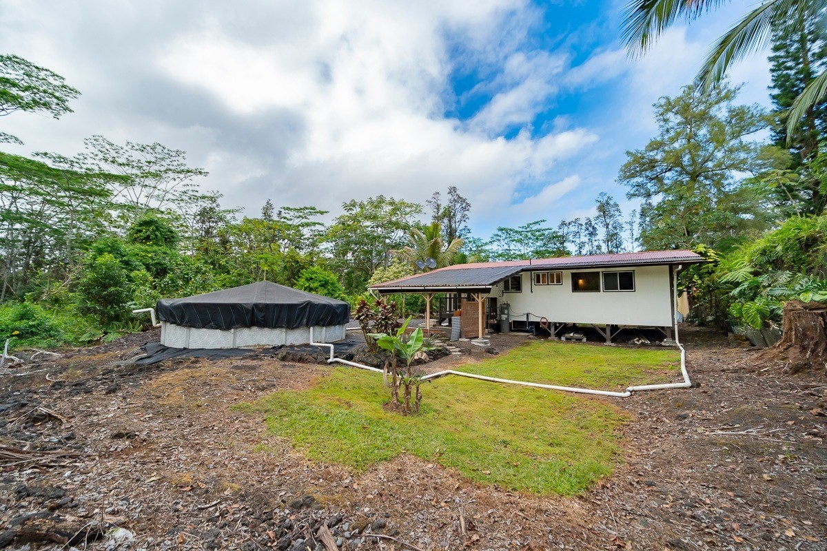 14-3508 Waimea Road Pahoa, HI 96778 - Photo 14 of 21 a view of a house with backyard and sitting area