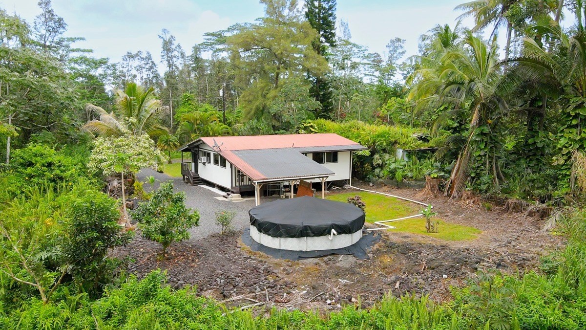 14-3508 Waimea Road Pahoa, HI 96778 - Photo 20 of 21 a view of a swimming pool and trees in the backyard