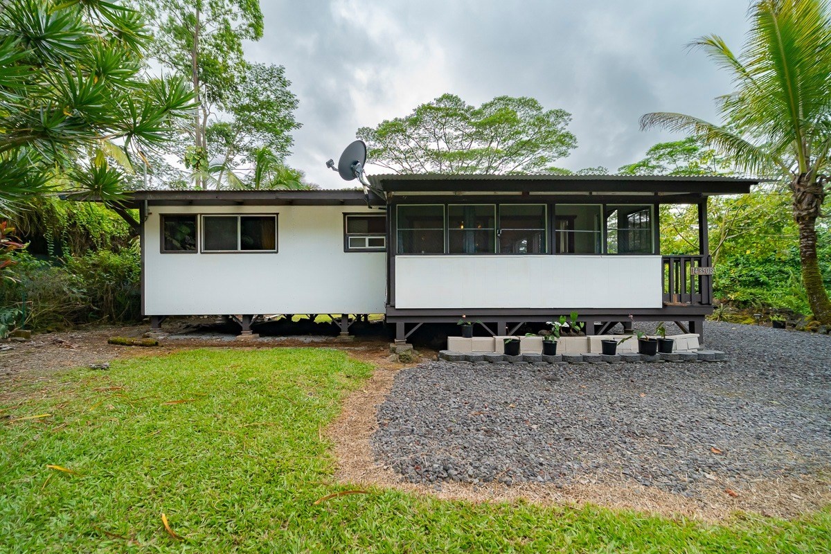 14-3508 Waimea Road Pahoa, HI 96778 - Photo 2 of 21 a view of a house with a yard and sitting area