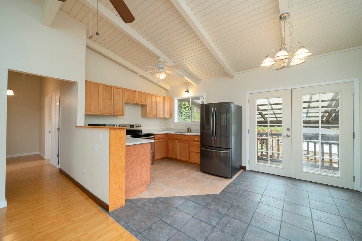 14-3508 Waimea Road Pahoa, HI 96778 - Photo 6 of 21 a kitchen with refrigerator and cabinets