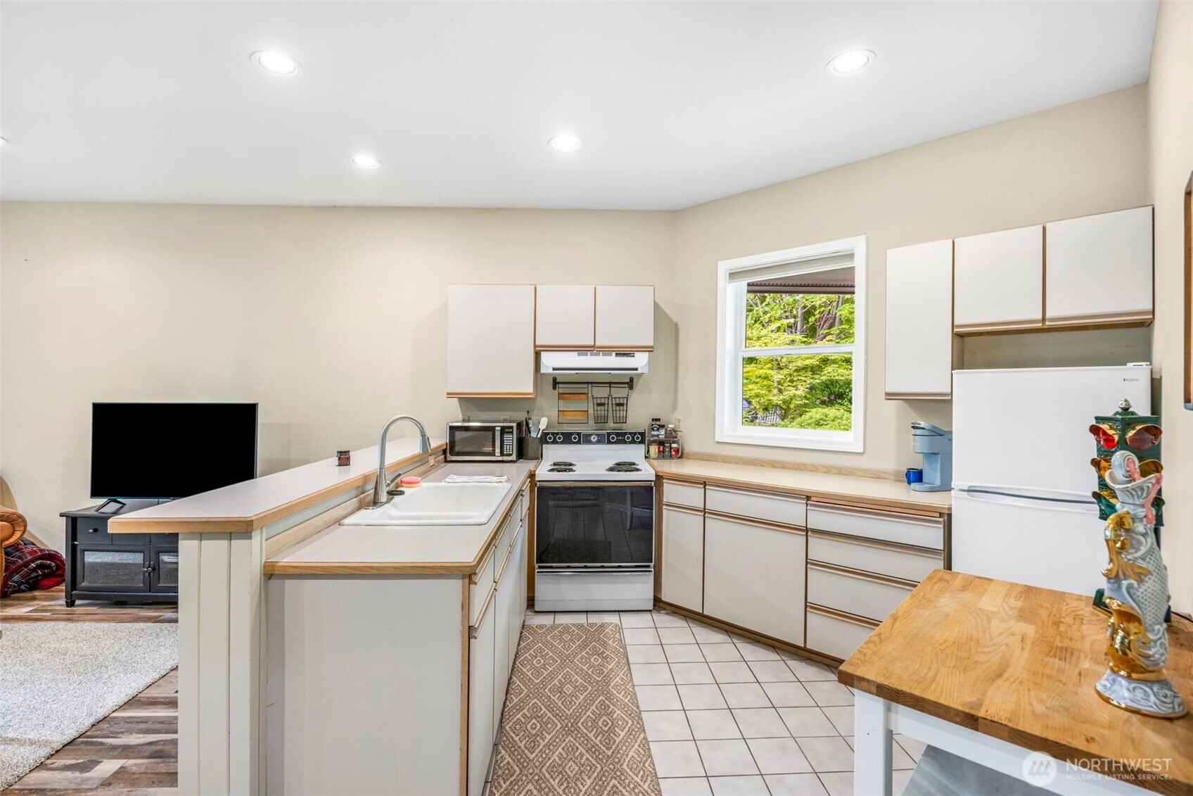 6591 Northeast North Shore Road Belfair, WA 98528 - Photo 34 of 37 a kitchen with a sink appliances and cabinets