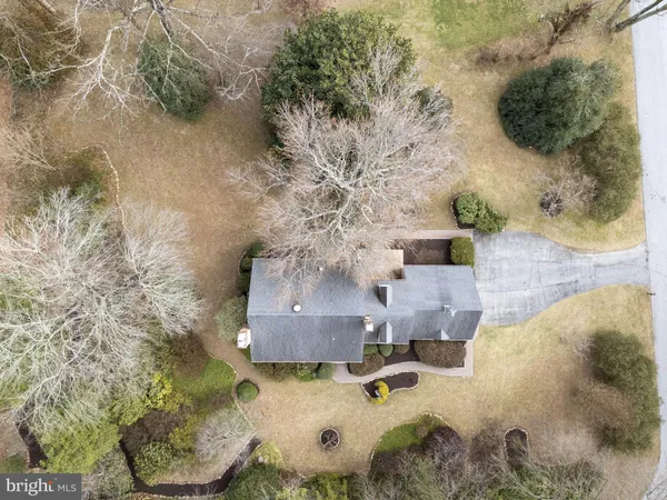 a aerial view of a house with a yard