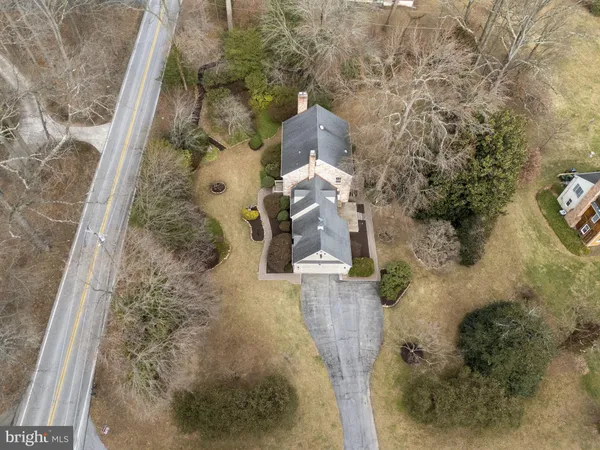 a aerial view of a house with a yard
