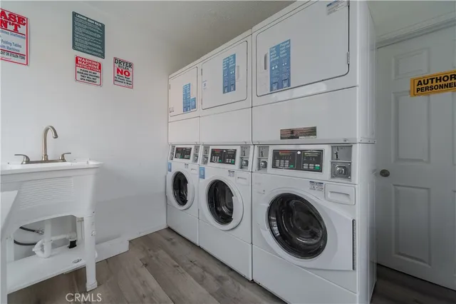 a view of swimming pool with outdoor seating and plants