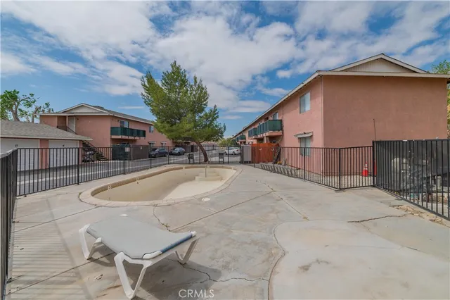 a house with swimming pool in front of it