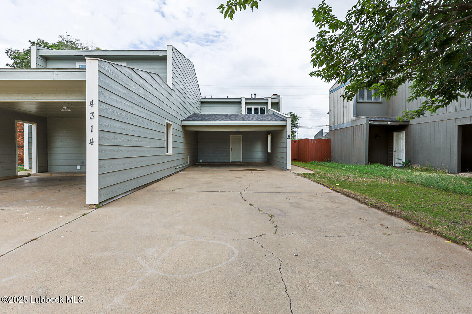 4314 52nd Street, Unit A Lubbock, TX 79413 - Photo 1 of 54 a view of a terrace with a garden
