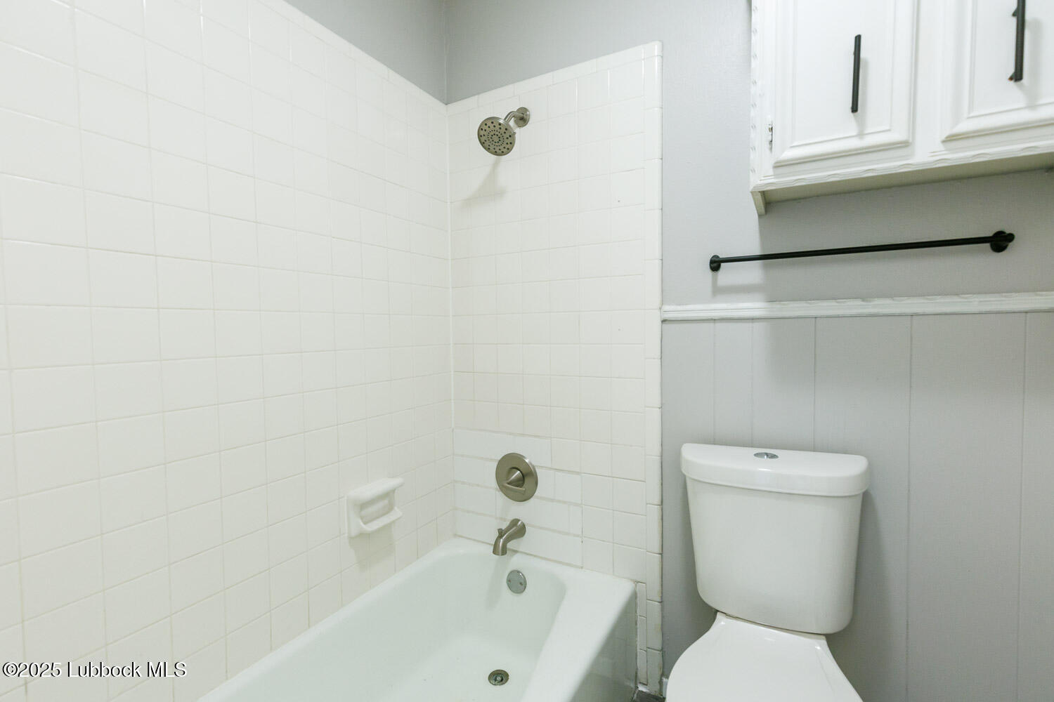 4314 52nd Street, Unit A Lubbock, TX 79413 - Photo 22 of 54 a white toilet sitting next to a bathroom sink