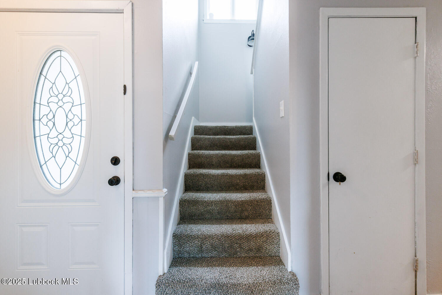 4314 52nd Street, Unit A Lubbock, TX 79413 - Photo 26 of 54 a view of staircase with wooden door