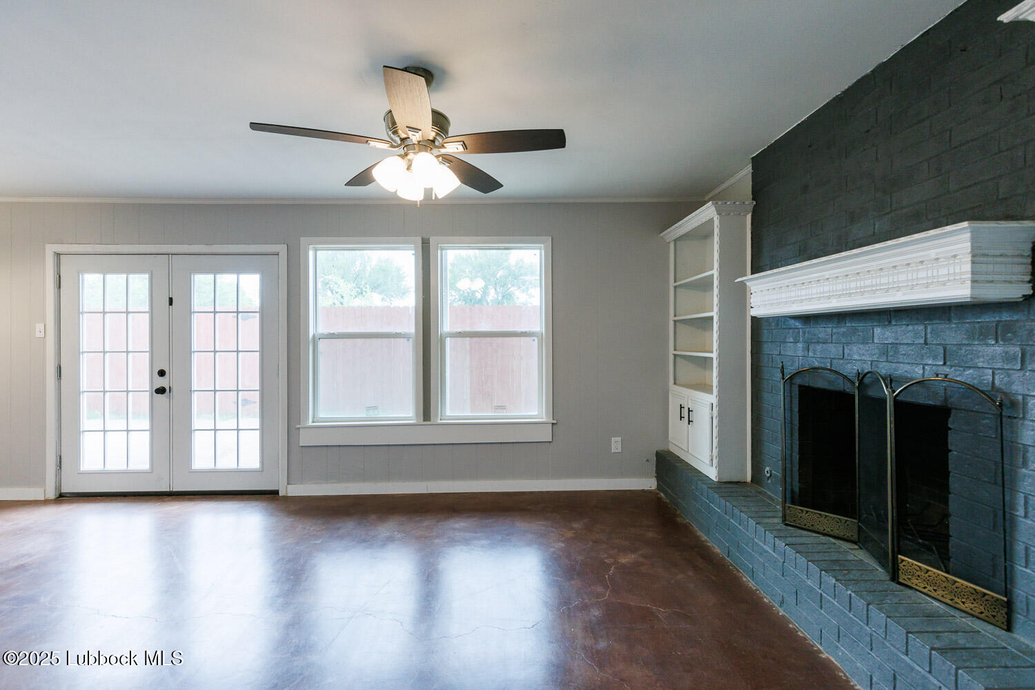4314 52nd Street, Unit A Lubbock, TX 79413 - Photo 30 of 54 a view of an empty room with wooden floor and a window