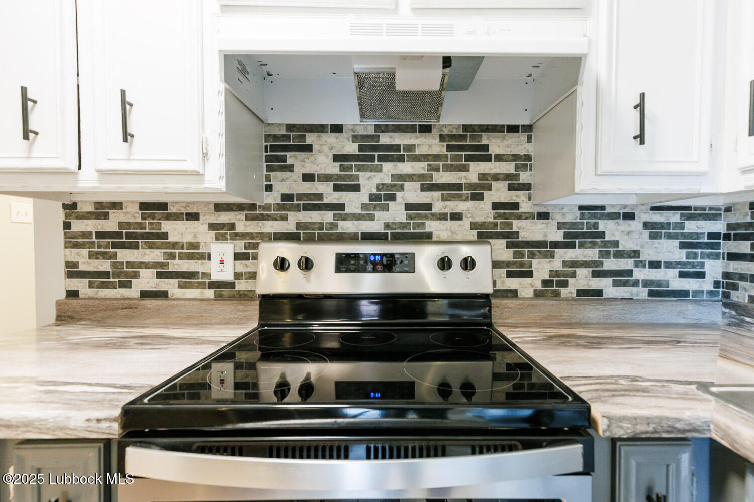 4314 52nd Street, Unit A Lubbock, TX 79413 - Photo 38 of 54 a stove top oven sitting inside of a kitchen