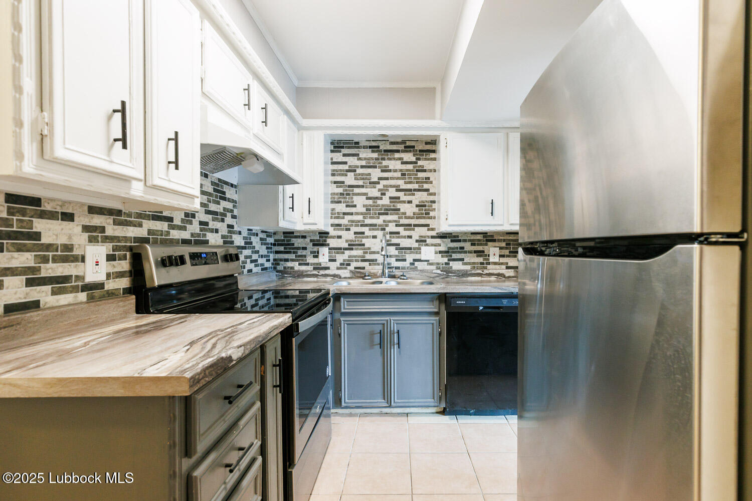 4314 52nd Street, Unit A Lubbock, TX 79413 - Photo 40 of 54 a kitchen with stainless steel appliances granite countertop a refrigerator and a stove