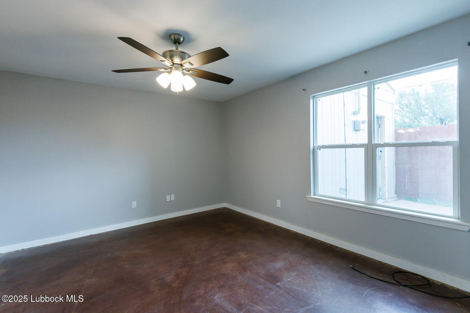 4314 52nd Street, Unit A Lubbock, TX 79413 - Photo 47 of 54 an empty room with a window and a fan