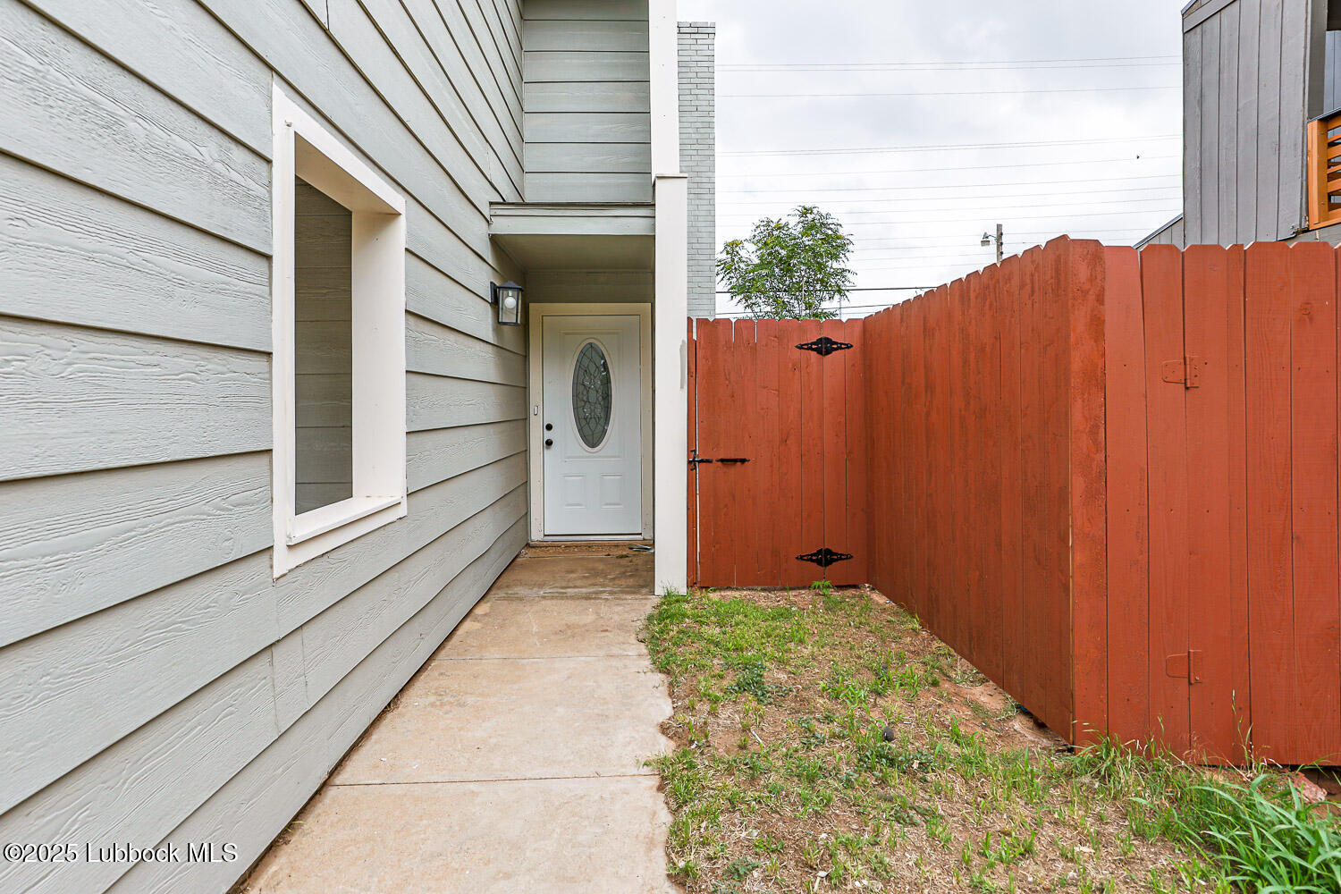 4314 52nd Street, Unit A Lubbock, TX 79413 - Photo 6 of 54 a view of a house with a backyard