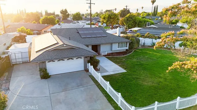 a aerial view of a house with a yard