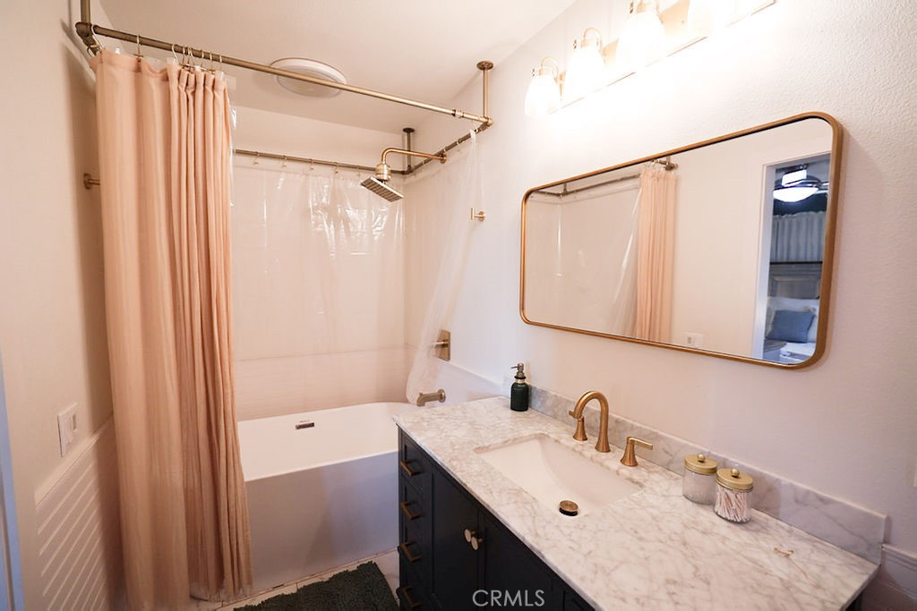 1156 3rd Street Calimesa, CA 92320 - Photo 20 of 34 a bathroom with a sink vanity and a mirror