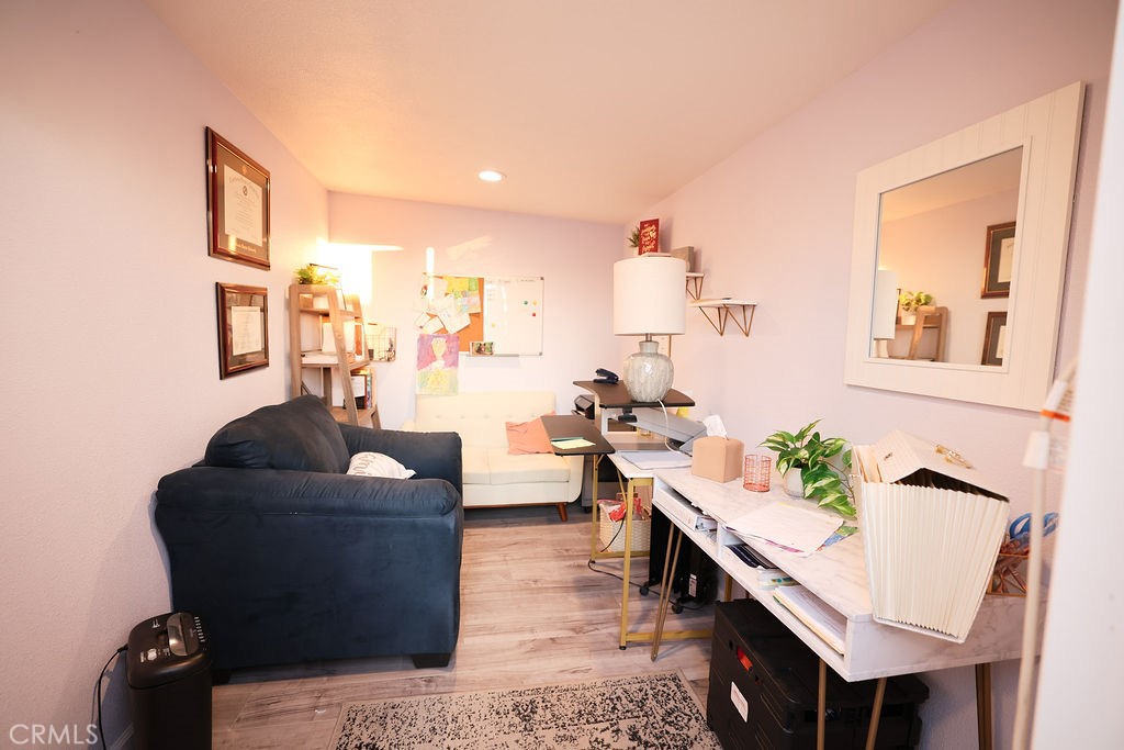 1156 3rd Street Calimesa, CA 92320 - Photo 27 of 34 a living room with furniture and wooden floor