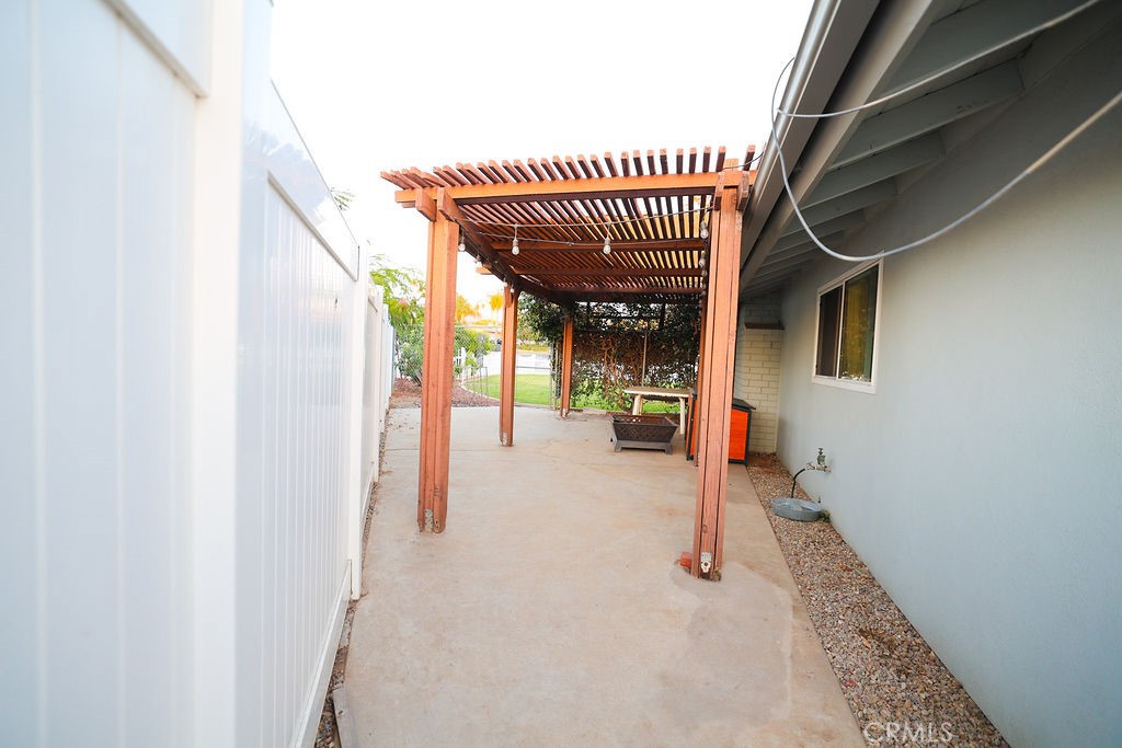 1156 3rd Street Calimesa, CA 92320 - Photo 28 of 34 a view of a hall with wooden floor