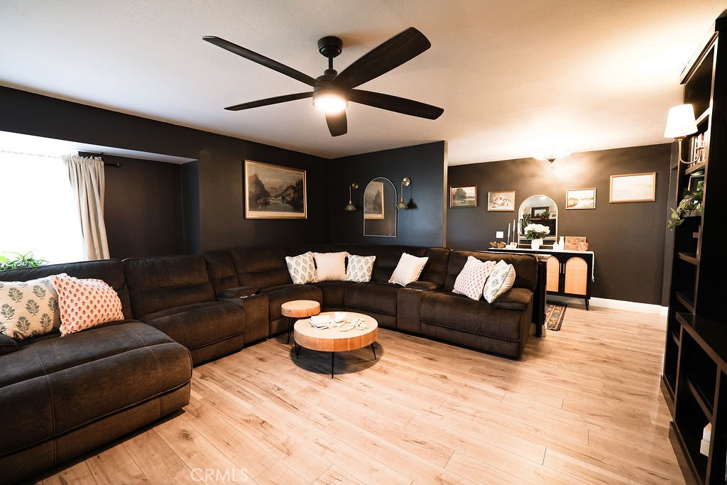 1156 3rd Street Calimesa, CA 92320 - Photo 7 of 34 a living room with furniture and a wooden floor