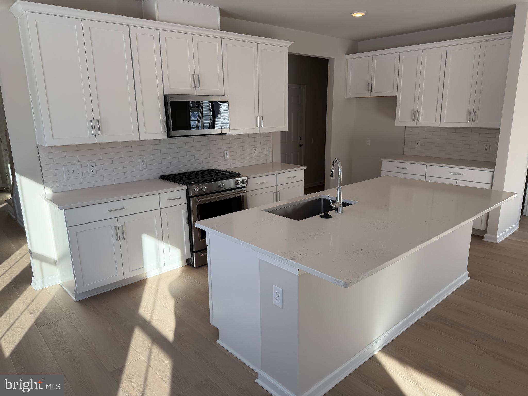 604 Liberty Ridge Road Horsham, PA 19044 - Photo 3 of 15 a kitchen that has a sink and a stove in it