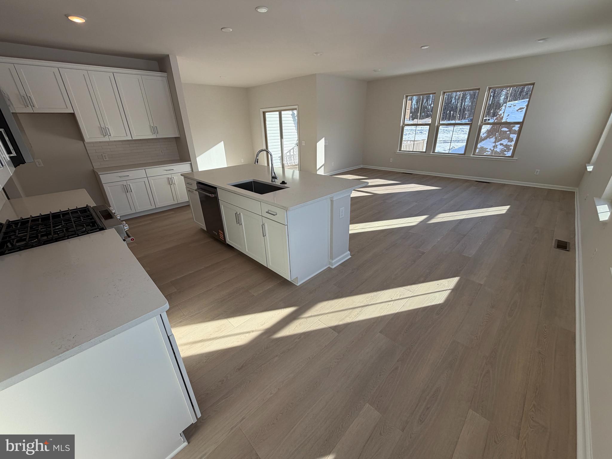 604 Liberty Ridge Road Horsham, PA 19044 - Photo 4 of 15 a kitchen with stainless steel appliances granite countertop a stove a sink and a refrigerator