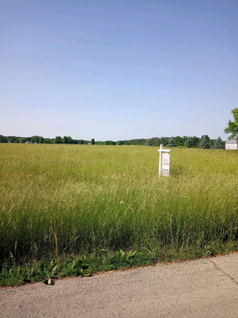 a view of a lake with a big yard